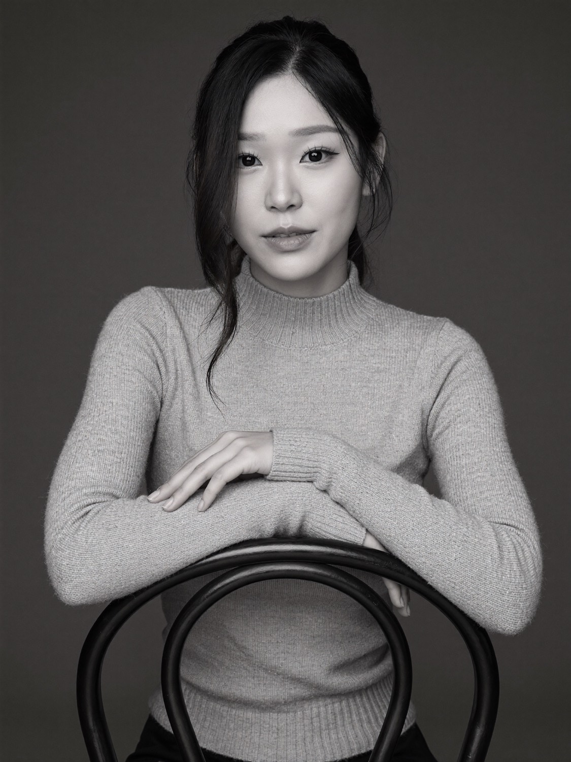 Cindy's generated portrait: Knit turtleneck on the bentwood chair (black and white)