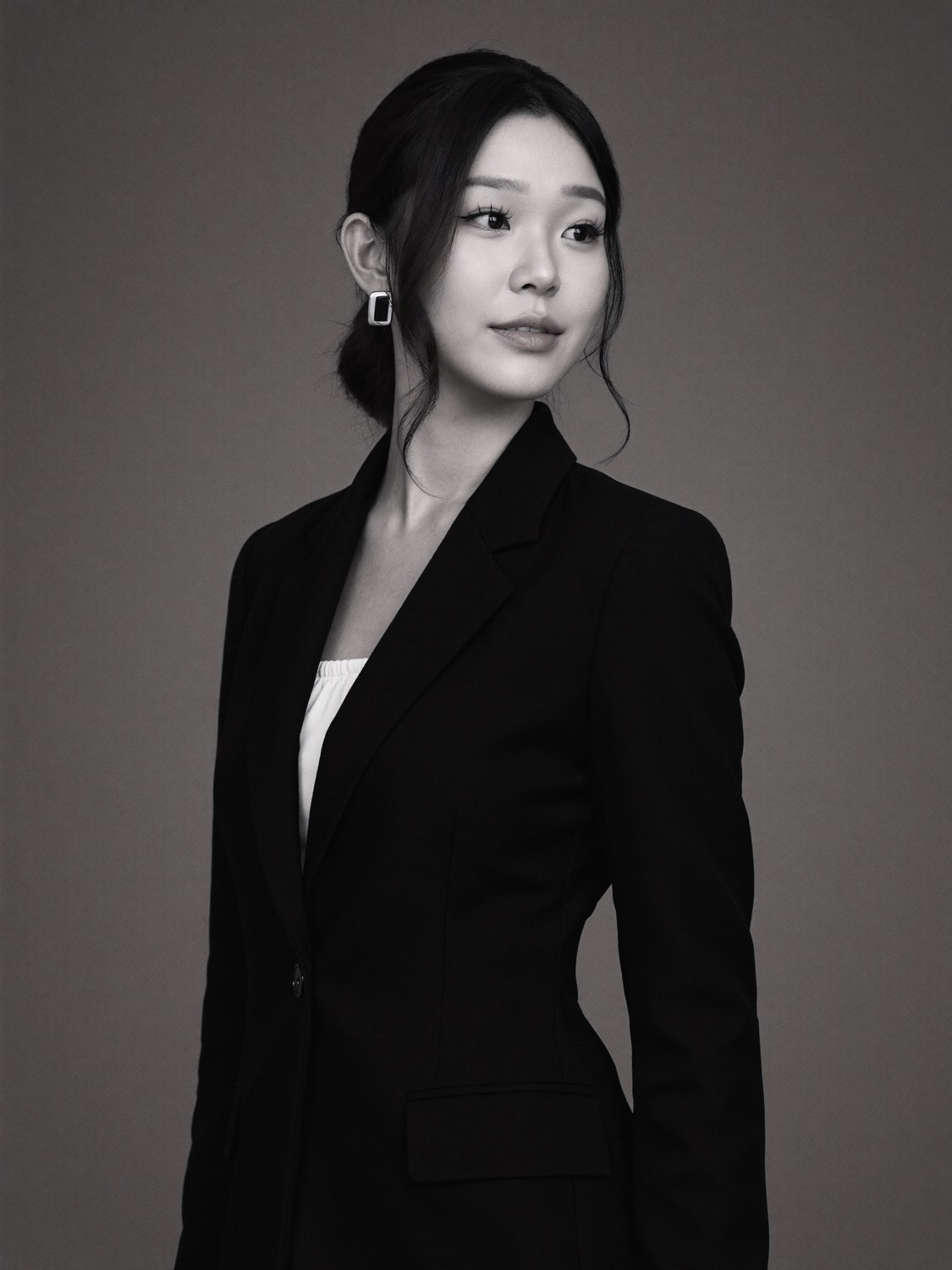Cindy's generated portrait: Black blazer, three-quarter turn (black and white)