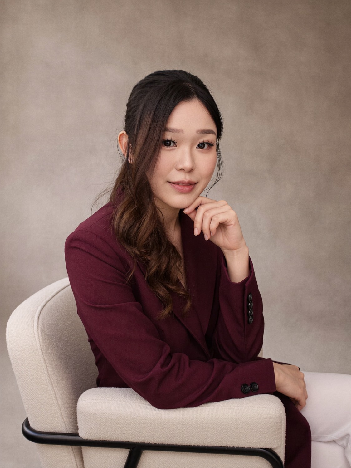 Cindy's generated portrait: Burgundy blazer in the boucle chair